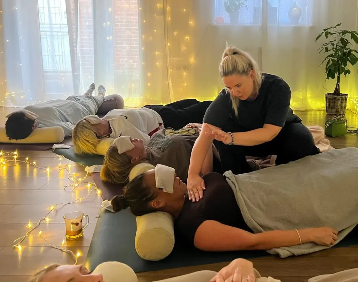Tina leading a group energy healing session